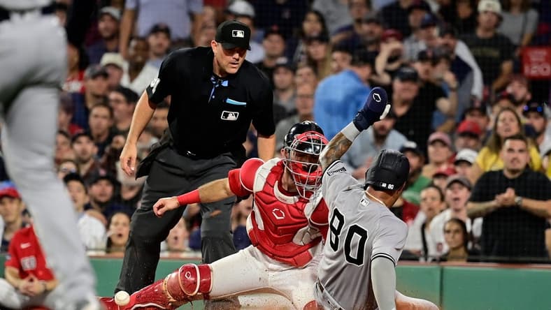 Sep 12, 2023; Boston, Massachusetts, USA; New York Yankees left fielder Everson Pereira (80) slides safe into home plate covered by Boston Red Sox catcher Connor Wong (12) during the fifth inning at Fenway Park. Mandatory Credit: Eric Canha-USA TODAY Sports