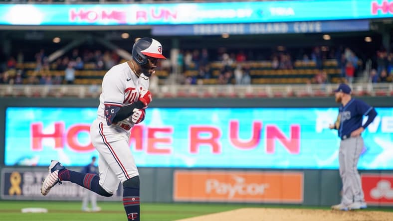 Sep 12, 2023; Minneapolis, Minnesota, USA; Minnesota Twins left fielder Willi Castro (50) hits a two run home run in the seventh inning against the Tampa Bay Rays at Target Field. Mandatory Credit: Matt Blewett-USA TODAY Sports