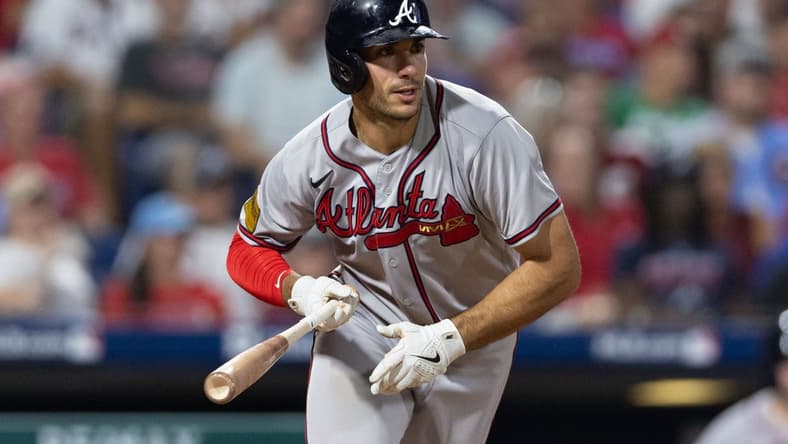 Sep 12, 2023; Philadelphia, Pennsylvania, USA; Atlanta Braves first baseman Matt Olson (28) hits a single during the seventh inning against the Philadelphia Phillies at Citizens Bank Park. Mandatory Credit: Bill Streicher-USA TODAY Sports