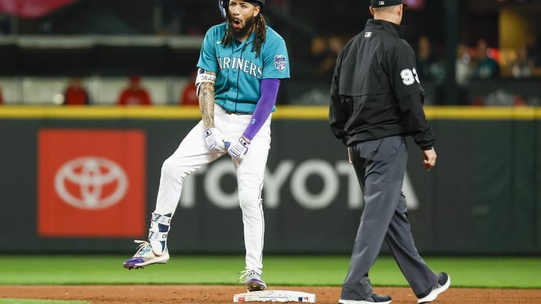 Sep 12, 2023; Seattle, Washington, USA; Seattle Mariners shortstop J.P. Crawford (3) celebrates after hitting a three-run double against the Los Angeles Angels during the fourth inning at T-Mobile Park. Mandatory Credit: Joe Nicholson-USA TODAY Sports