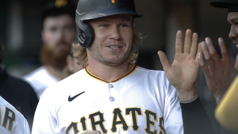 Sep 13, 2023; Pittsburgh, Pennsylvania, USA; Pittsburgh Pirates center fielder Jack Suwinski (65) celebrates in the dugout after scoring a run against the Washington Nationals during the first inning at PNC Park. Mandatory Credit: Charles LeClaire-USA TODAY Sports