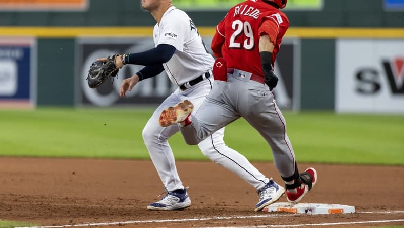 Sep 13, 2023; Detroit, Michigan, USA; Cincinnati Reds center fielder TJ Friedl (29) beats the throw to Detroit Tigers first baseman Spencer Torkelson (20) in the fourth inning at Comerica Park. Mandatory Credit: David Reginek-USA TODAY Sports