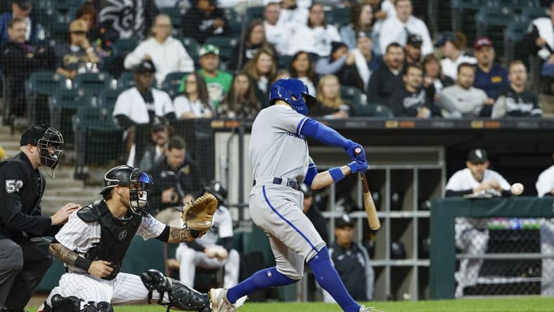 Sep 13, 2023; Chicago, Illinois, USA; Kansas City Royals second baseman Michael Massey (19) hits a two-run home run against the Chicago White Sox during the second inning at Guaranteed Rate Field. Mandatory Credit: Kamil Krzaczynski-USA TODAY Sports