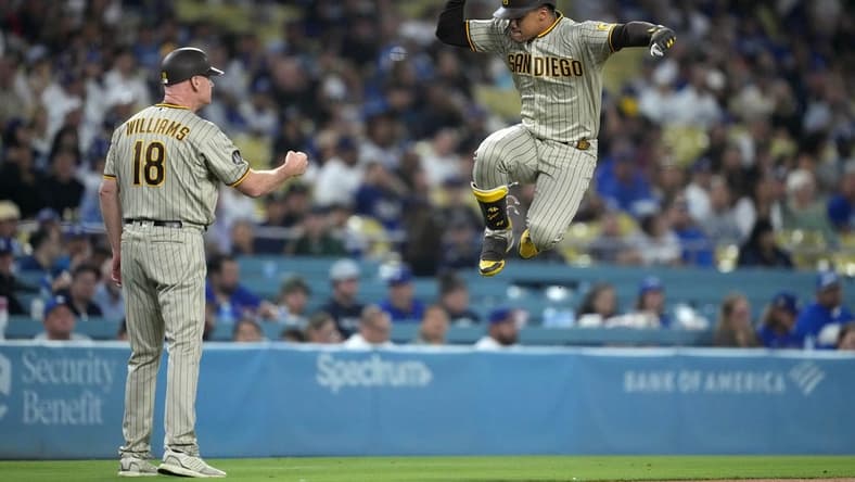 Sep 13, 2023; Los Angeles, California, USA; San Diego Padres left fielder Juan Soto (22) celebrates with third base coach and infield instructor Matt Williams (18) after hitting a home riun in the first inning against the Los Angeles Dodgers at Dodger Stadium. Mandatory Credit: Kirby Lee-USA TODAY Sports