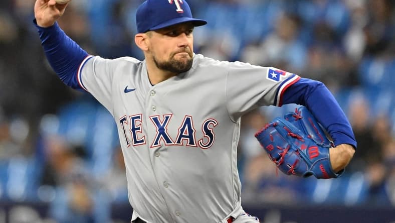 Sep 14, 2023; Toronto, Ontario, CAN; Texas Rangers starting pitcher Nathan Eovaldi (17) delivers a pitch against the Toronto Blue Jays in the first inning at Rogers Centre. Mandatory Credit: Dan Hamilton-USA TODAY Sports