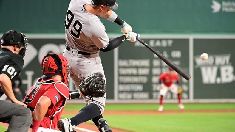 Sep 14, 2023; Boston, Massachusetts, USA; New York Yankees designated hitter Aaron Judge (99) hits a three run home run during the second inning against the Boston Red Sox at Fenway Park. Mandatory Credit: Eric Canha-USA TODAY Sports