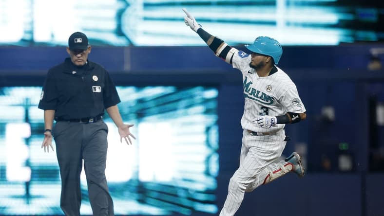Sep 15, 2023; Miami, Florida, USA; Miami Marlins second baseman Luis Arraez (3) hits a home run against the Atlanta Braves during the first inning at loanDepot Park. Mandatory Credit: Rhona Wise-USA TODAY Sports