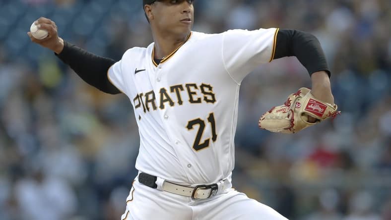 Sep 15, 2023; Pittsburgh, Pennsylvania, USA;  Pittsburgh Pirates starting pitcher Johan Oviedo (24 wearing 21) delivers a pitch against the New York Yankees during the first inning at PNC Park. Mandatory Credit: Charles LeClaire-USA TODAY Sports