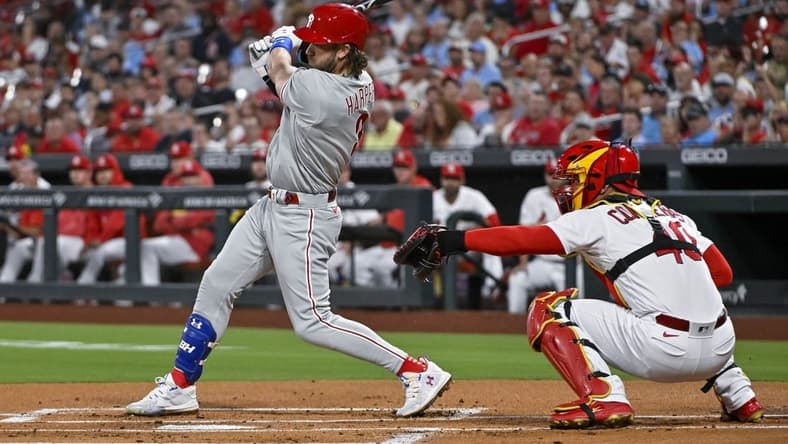 Sep 15, 2023; St. Louis, Missouri, USA;  Philadelphia Phillies first baseman Bryce Harper (3) drives in a run on a fielders choice against the St. Louis Cardinals during the first inning at Busch Stadium. Mandatory Credit: Jeff Curry-USA TODAY Sports