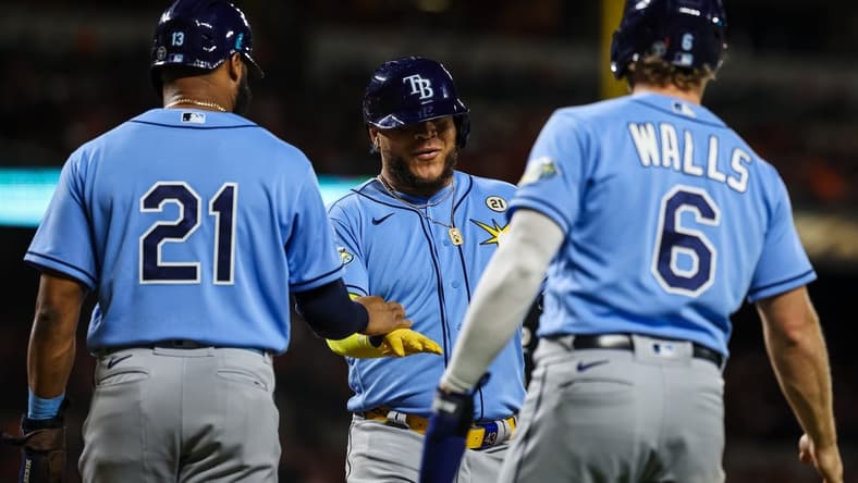 Sep 15, 2023; Baltimore, Maryland, USA; Tampa Bay Rays designated hitter Harold Ramirez (43) celebrates with center fielder Manuel Margot (13) and third baseman Taylor Walls (6) after hitting a three run home run against the Baltimore Orioles during the sixth inning at Oriole Park at Camden Yards. Mandatory Credit: Scott Taetsch-USA TODAY Sports