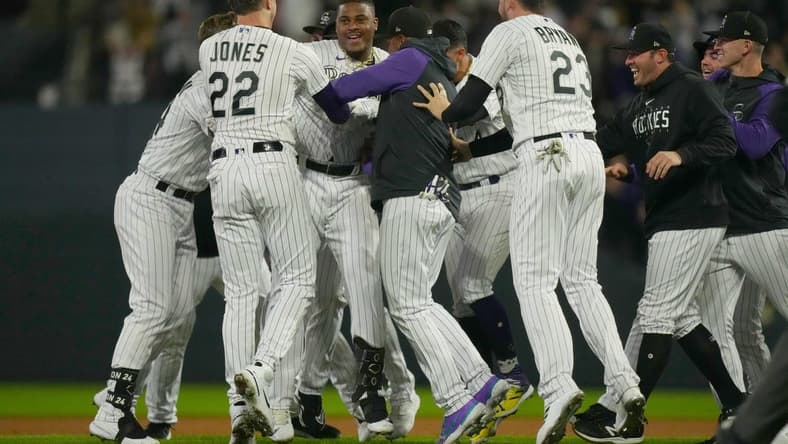 Sep 15, 2023; Denver, Colorado, USA; Colorado Rockies first baseman Elehuris Montero (44) and Colorado Rockies left fielder Nolan Jones (22) and Colorado Rockies designated hitter Kris Bryant (23) celebrate defeating the San Francisco Giants in the ninth inning at Coors Field. Mandatory Credit: Ron Chenoy-USA TODAY Sports