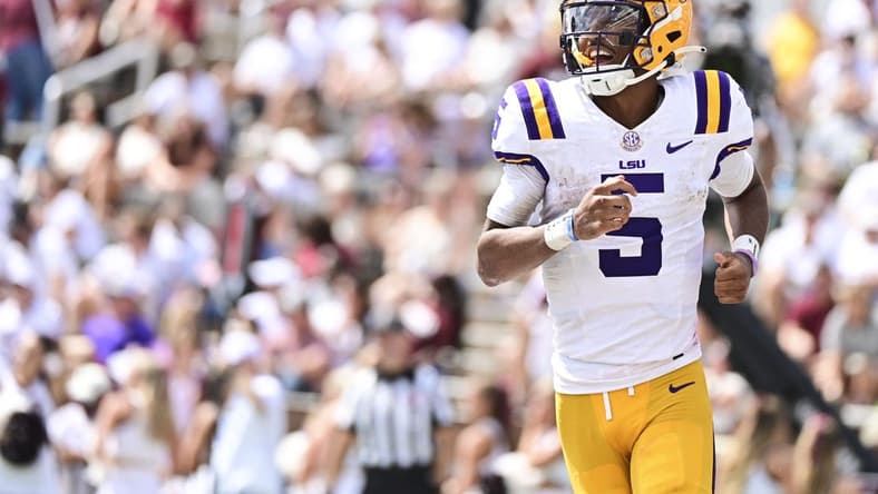 Sep 16, 2023; Starkville, Mississippi, USA; LSU Tigers quarterback Jayden Daniels (5) reacts after a play against the Mississippi State Bulldogs during the second half at Davis Wade Stadium at Scott Field. Mandatory Credit: Matt Bush-USA TODAY Sports