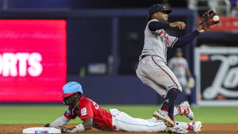 Sep 16, 2023; Miami, Florida, USA; Miami Marlins center fielder Jazz Chisholm Jr. (2) steals second base against Atlanta Braves second baseman Ozzie Albies (1) during the fifth inning at loanDepot Park. Mandatory Credit: Sam Navarro-USA TODAY Sports