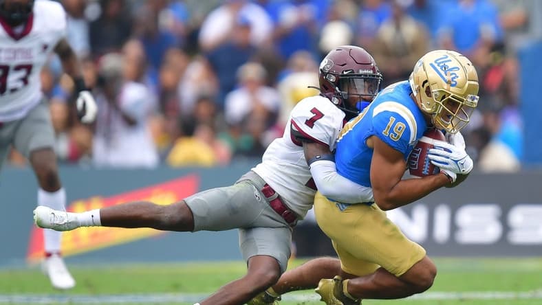 Sep 16, 2023; Pasadena, California, USA; UCLA Bruins wide receiver Kyle Ford (19) is brought down by North Carolina Central Eagles defensive back JaJuan Hudson (7) during the first half at Rose Bowl. Mandatory Credit: Gary A. Vasquez-USA TODAY Sports