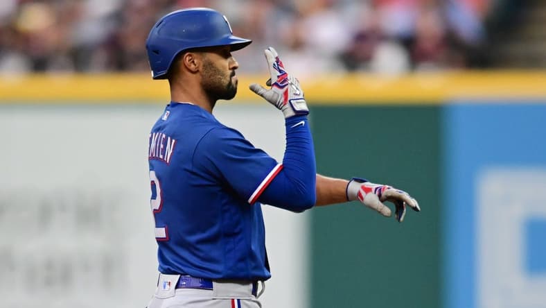 Sep 16, 2023; Cleveland, Ohio, USA; Texas Rangers second baseman Marcus Semien (2) celebrates after hitting an RBI double during the fifth inning against the Cleveland Guardians at Progressive Field. Mandatory Credit: Ken Blaze-USA TODAY Sports