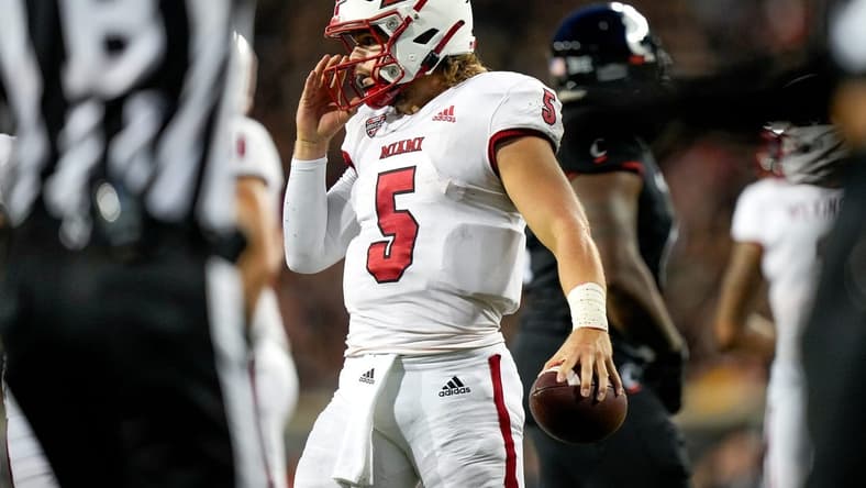 Miami (Oh) RedHawks quarterback Brett Gabbert (5) holds the ball between plays during the NCAA football game between the Cincinnati Bearcats and the Miami RedHawks at Nippert Stadium in Cincinnati on Saturday, Sept. 16, 2023.