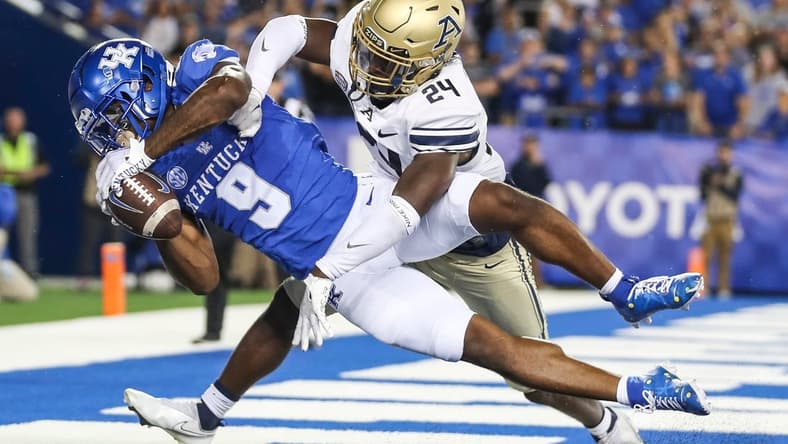 Kentucky Wildcats wide receiver Tayvion Robinson (9) makes a late second quarter touchdown catch over Akron Zips cornerback Darrian Lewis (24) to put the Cats up by two touchdowns in the first half in Saturday's game at Kroger Field in Lexington. Sept. 16, 2023