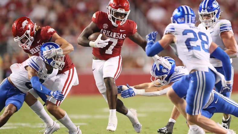 Sep 16, 2023; Fayetteville, Arkansas, USA; Arkansas Razorbacks running back Rashod Dubinion (7) rushes in the second quarter against the BYU Cougars at Donald W. Reynolds Razorback Stadium. Mandatory Credit: Nelson Chenault-USA TODAY Sports