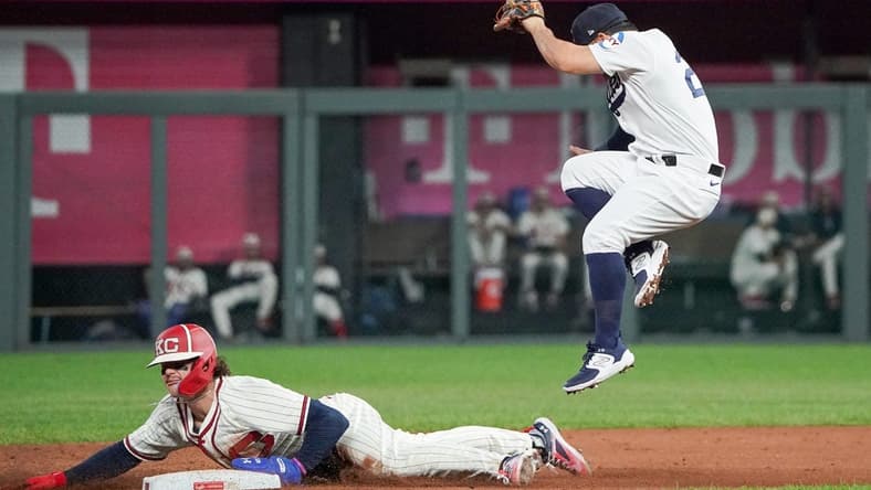 Sep 16, 2023; Kansas City, Missouri, USA; Houston Astros second baseman Jose Altuve (27) can   t make the tag as Kansas City Royals shortstop Bobby Witt Jr. (7) steals second base in the third inning at Kauffman Stadium. Mandatory Credit: Denny Medley-USA TODAY Sports