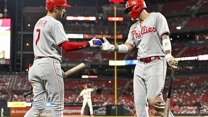Sep 16, 2023; St. Louis, Missouri, USA;  Philadelphia Phillies right fielder Nick Castellanos (8) celebrates with shortstop Trea Turner (7) after scoring against the St. Louis Cardinals during the ninth inning at Busch Stadium. Mandatory Credit: Jeff Curry-USA TODAY Sports