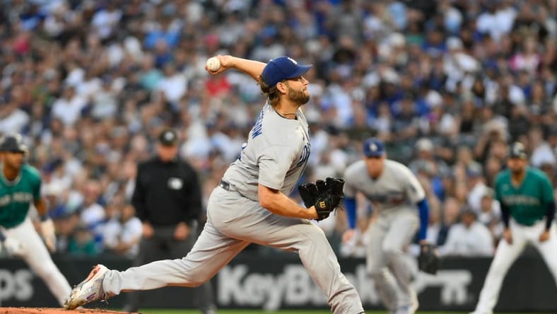 Sep 16, 2023; Seattle, Washington, USA; Los Angeles Dodgers starting pitcher Clayton Kershaw (22) throws against the Seattle Mariners during the first inning at T-Mobile Park. Mandatory Credit: Steven Bisig-USA TODAY Sports