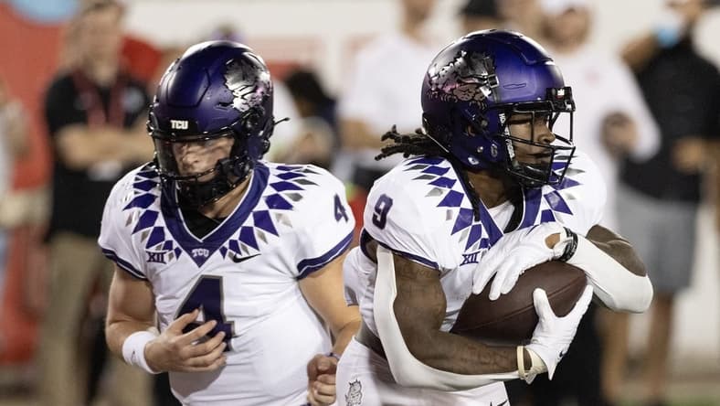 Sep 16, 2023; Houston, Texas, USA; TCU Horned Frogs quarterback Chandler Morris (4) hands the ball off to running back Emani Bailey (9) against the Houston Cougars in the first half at TDECU Stadium. Mandatory Credit: Thomas Shea-USA TODAY Sports