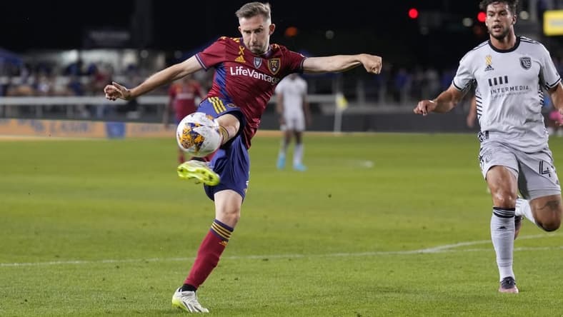 Sep 16, 2023; San Jose, California, USA; Real Salt Lake defender Andrew Brody (center) attempts a shot against the San Jose Earthquakes during the first half at PayPal Park. Mandatory Credit: Darren Yamashita-USA TODAY Sports