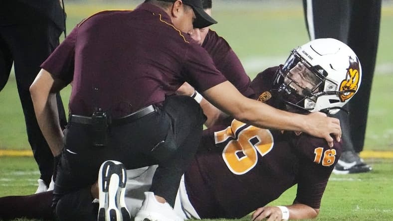 Arizona State Sun Devils quarterback Trenton Bourguet (16) grimaces after an ankle injury that forced him to leave the game against the Fresno State Bulldogs in the first half at Mountain America Stadium in Tempe on Sept. 16, 2023.