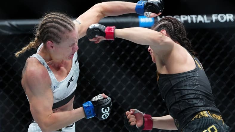 Sep 16, 2023; Las Vegas, Nevada, USA; Alexa Grasso (red gloves) fights Valentina Shevchenko (blue gloves) during UFC Fight Night at T-Mobile Arena. Mandatory Credit: Stephen R. Sylvanie-USA TODAY Sports