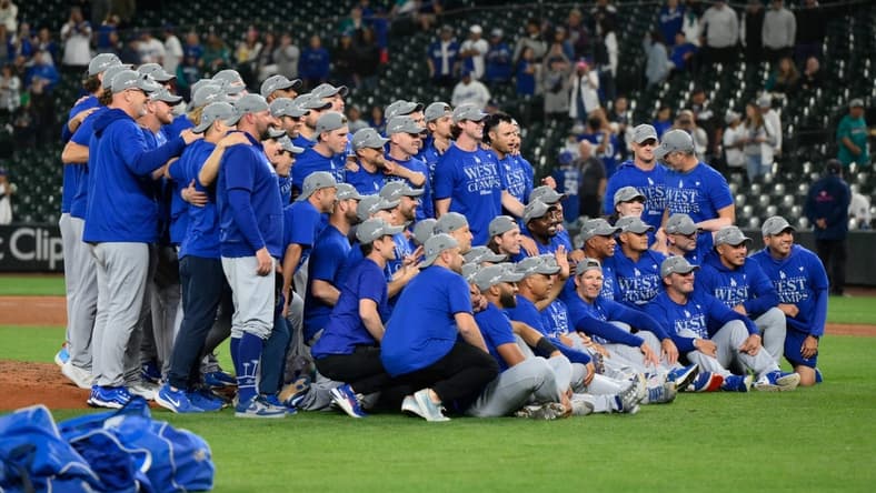 Sep 16, 2023; Seattle, Washington, USA; The Los Angeles Dodgers post for a team photo after winning the National League West division after the game against the Seattle Mariners at T-Mobile Park. Mandatory Credit: Steven Bisig-USA TODAY Sports