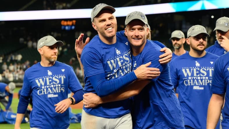 Sep 16, 2023; Seattle, Washington, USA; The Los Angeles Dodgers celebrate after winning the National League West division after the game against the Seattle Mariners at T-Mobile Park. Mandatory Credit: Steven Bisig-USA TODAY Sports