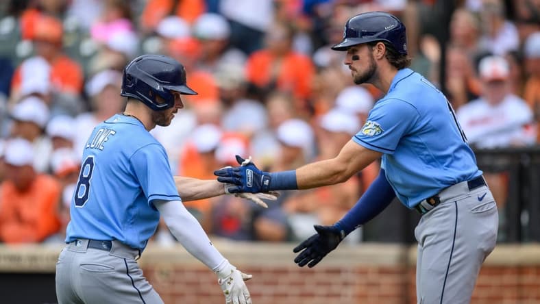 Sep 17, 2023; Baltimore, Maryland, USA; Tampa Bay Rays second baseman Brandon Lowe (8) and right fielder Josh Lowe (15) celebrate after a home run during the first inning against the Baltimore Orioles at Oriole Park at Camden Yards. Mandatory Credit: Reggie Hildred-USA TODAY Sports