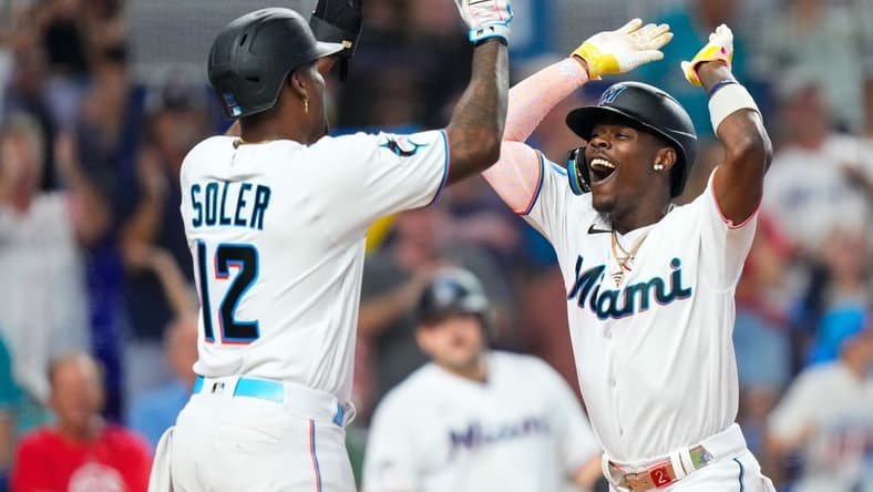 Sep 17, 2023; Miami, Florida, USA; Miami Marlins center fielder Jazz Chisholm Jr. (2) celebrates with Miami Marlins designated hitter Jorge Soler (12) after hitting a grand slam against the Atlanta Braves at loanDepot Park. Mandatory Credit: Rich Storry-USA TODAY Sports