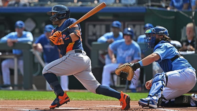 Sep 17, 2023; Kansas City, Missouri, USA; Houston Astros second baseman Jose Altuve (27) hits a single in the first inning against the Kansas City Royals at Kauffman Stadium. Mandatory Credit: Peter Aiken-USA TODAY Sports