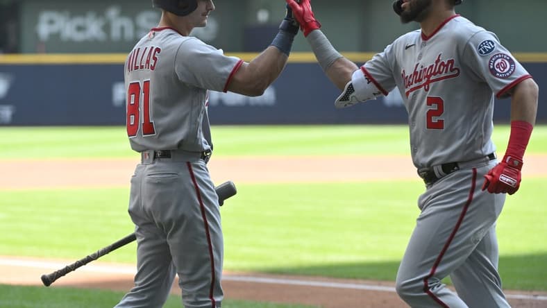 Sep 17, 2023; Milwaukee, Wisconsin, USA;Washington Nationals catcher Drew Millas (81), left congratulates Washington Nationals second baseman Luis Garcia (2) after hitting a home run against the Milwaukee Brewers in the first inning at American Family Field. Mandatory Credit: Michael McLoone-USA TODAY Sports