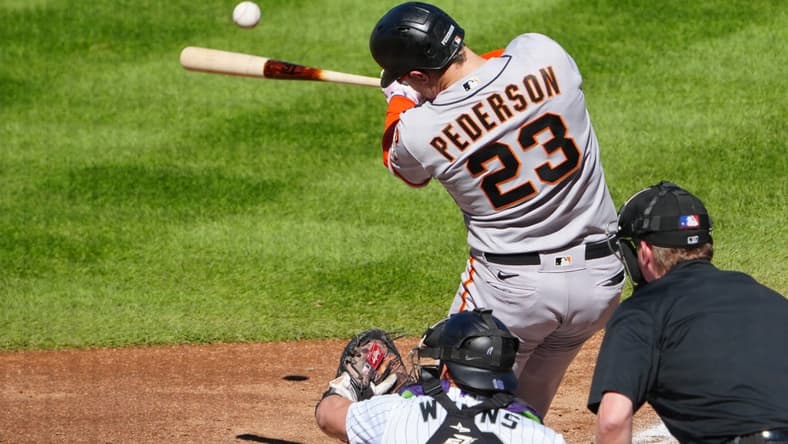 Sep 17, 2023; Denver, Colorado, USA; San Francisco Giants designated hitter Joc Pederson (23) hits a RBI double in the sixth inning against the Colorado Rockies at Coors Field. Mandatory Credit: Ron Chenoy-USA TODAY Sports