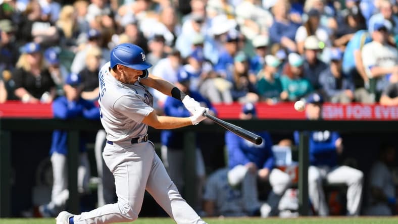Sep 17, 2023; Seattle, Washington, USA; Los Angeles Dodgers catcher Austin Barnes (15) hits a 2-run home run against the Seattle Mariners during the second inning at T-Mobile Park. Mandatory Credit: Steven Bisig-USA TODAY Sports