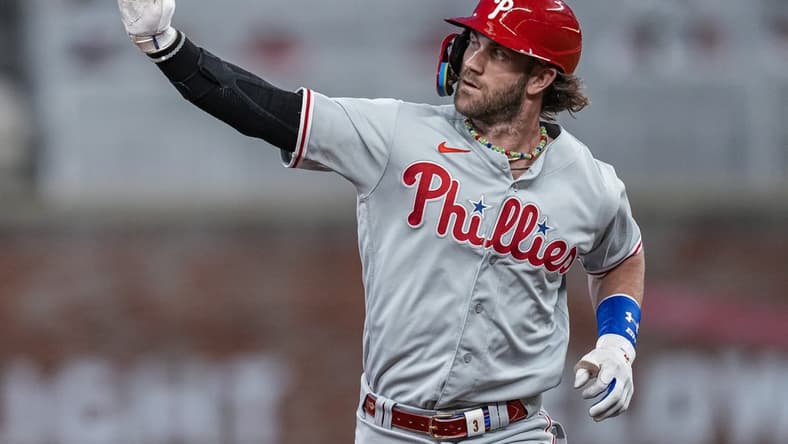 Sep 18, 2023; Cumberland, Georgia, USA; Philadelphia Phillies first baseman Bryce Harper (3) reacts as he runs the bases after hitting a home run against the Atlanta Braves during the third inning at Truist Park. Mandatory Credit: Dale Zanine-USA TODAY Sports