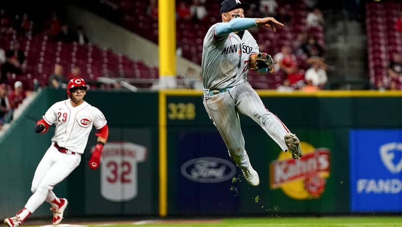 Minnesota Twins third baseman Royce Lewis (23) throws to first base for an out in the seventh inning of a baseball game against the Cincinnati Reds, Monday, Sept. 18, 2023, at Great American Ball Park in Cincinnati.