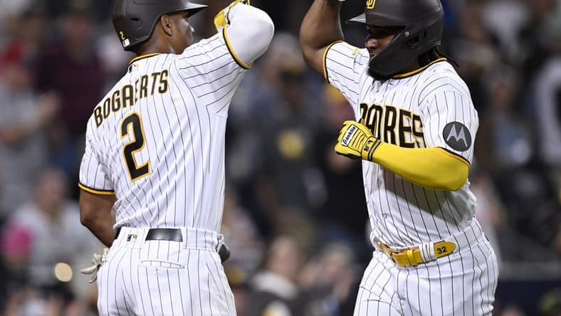 Sep 18, 2023; San Diego, California, USA; San Diego Padres third baseman Eguy Rosario (right) is congratulated by shortstop Xander Bogaerts (2) after hitting a home run against the Colorado Rockies during the third inning at Petco Park. Mandatory Credit: Orlando Ramirez-USA TODAY Sports