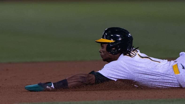 Sep 18, 2023; Oakland, California, USA;  Oakland Athletics center fielder Esteury Ruiz (1) slides during the eighth inning against Seattle Mariners at Oakland-Alameda County Coliseum. Mandatory Credit: Stan Szeto-USA TODAY Sports