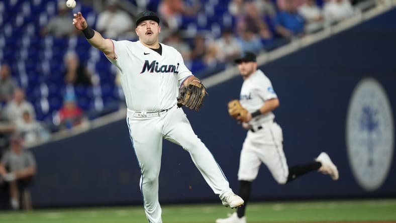 Sep 19, 2023; Miami, Florida, USA; Miami Marlins third baseman Jake Burger (36) throws out New York Mets catcher Francisco Alvarez at first base in the first inning at loanDepot Park. Mandatory Credit: Jim Rassol-USA TODAY Sports