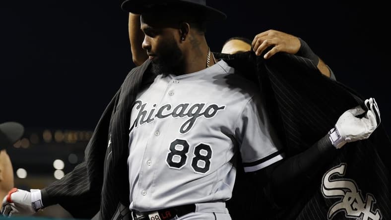Sep 19, 2023; Washington, District of Columbia, USA; Chicago White Sox center fielder Luis Robert Jr. (88) is given the "Southside Jacket" by White Sox shortstop Elvis Andrus (1) after hitting a home run against the Washington Nationals during the fourth inning at Nationals Park. Mandatory Credit: Geoff Burke-USA TODAY Sports