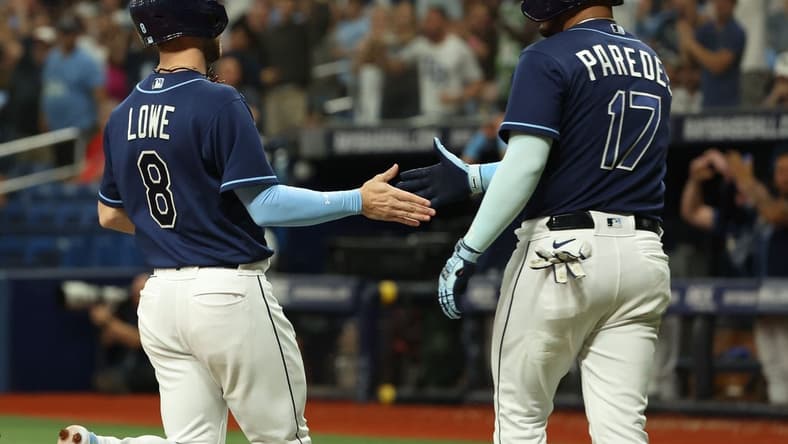 Sep 19, 2023; St. Petersburg, Florida, USA; Tampa Bay Rays second baseman Brandon Lowe (8) and third baseman Isaac Paredes (17) celebrate as they both score during the eighth inning against the Los Angeles Angels at Tropicana Field. Mandatory Credit: Kim Klement Neitzel-USA TODAY Sports