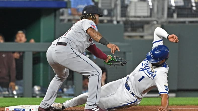 Sep 19, 2023; Kansas City, Missouri, USA; Kansas City Royals left fielder MJ Melendez (1) slides into third base safely against Cleveland Guardians third baseman Jose Ramirez (11) in the third inning at Kauffman Stadium. Mandatory Credit: Peter Aiken-USA TODAY Sports
