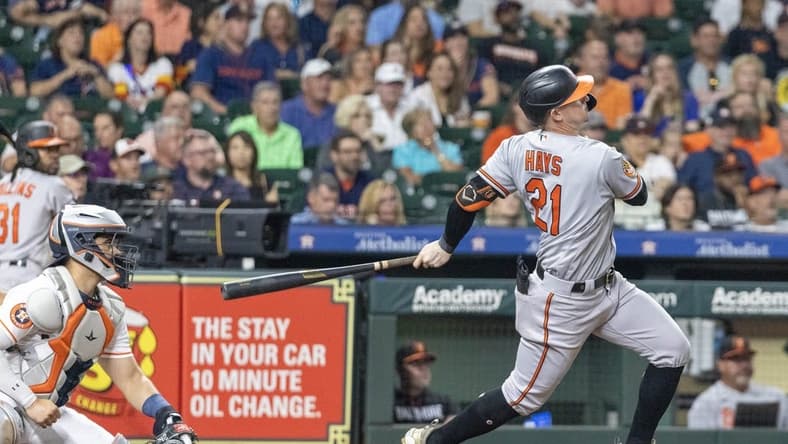 Sep 19, 2023; Houston, Texas, USA; Baltimore Orioles left fielder Austin Hays (21) hits a three run home run against the Houston Astros in the third inning at Minute Maid Park. Mandatory Credit: Thomas Shea-USA TODAY Sports