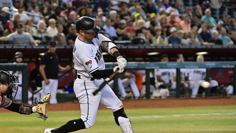Sep 20, 2023; Phoenix, Arizona, USA;  Arizona Diamondbacks first baseman Christian Walker (53) hits a single in the third inning against the San Francisco Giants at Chase Field. Mandatory Credit: Matt Kartozian-USA TODAY Sports
