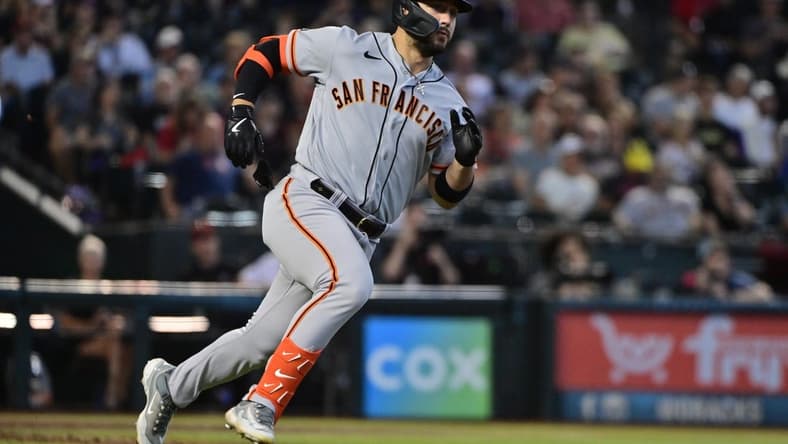 Sep 20, 2023; Phoenix, Arizona, USA; San Francisco Giants right fielder Michael Conforto (8) runs after hitting a double in the second inning against the Arizona Diamondbacks at Chase Field. Mandatory Credit: Matt Kartozian-USA TODAY Sports