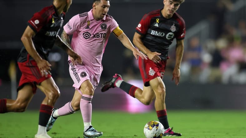 Sep 20, 2023; Fort Lauderdale, Florida, USA; Inter Miami forward Lionel Messi (10) kicks the ball past Toronto FC during the first half at DRV PNK Stadium. Mandatory Credit: Sam Navarro-USA TODAY Sports
