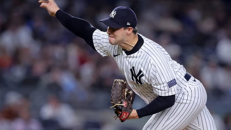 Sep 20, 2023; Bronx, New York, USA; New York Yankees relief pitcher Tommy Kahnle (41) pitches against the Toronto Blue Jays during the eighth inning at Yankee Stadium. Mandatory Credit: Brad Penner-USA TODAY Sports
